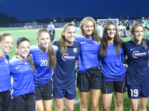 Christie Rampone & Kelley O'Hara posing with fans. Fan Friendly 